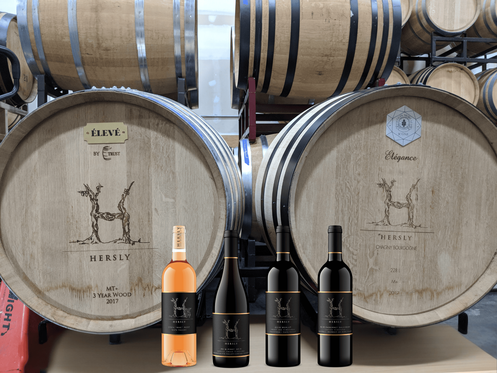 Hersly Wine barrels with 4 Hersly Wine bottles shown in front